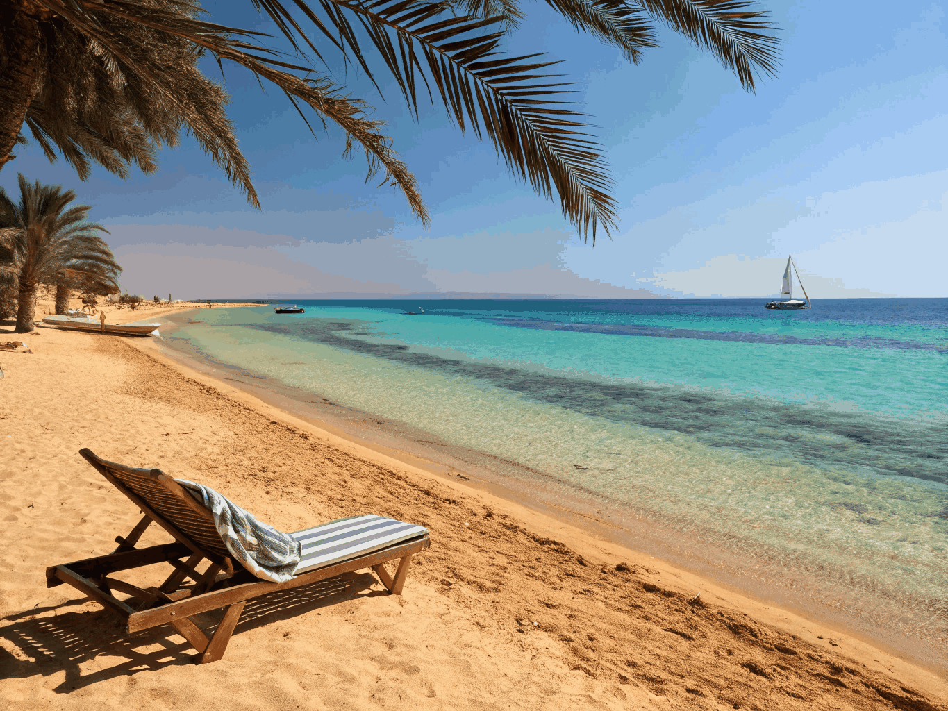 Golden hour coastline over calm Red Sea waters and Hurghada sand dunes