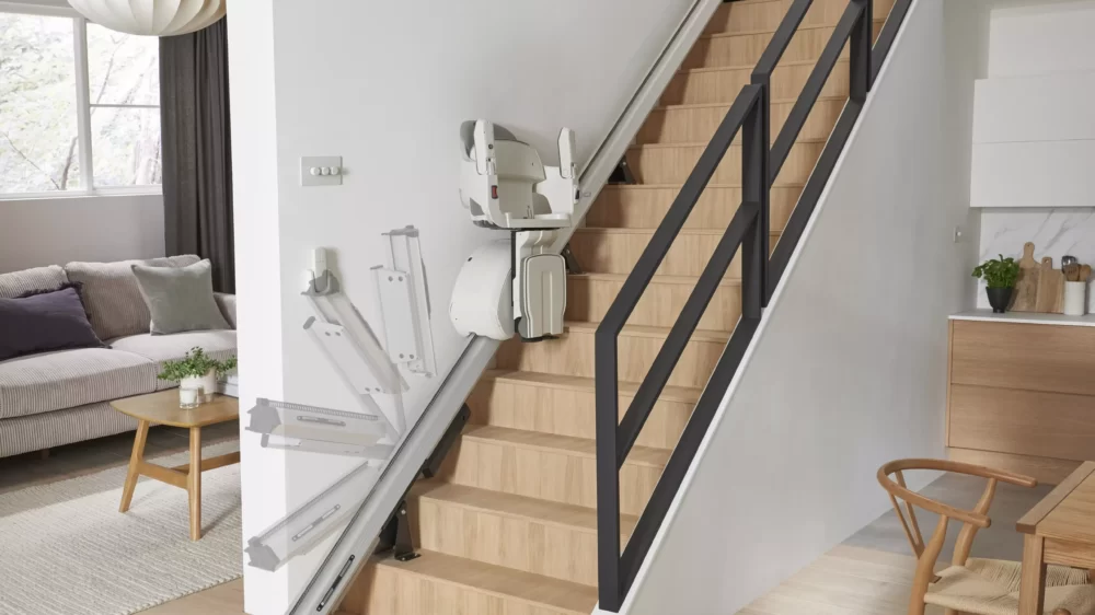 HomeGlide powered folding rail lifting at bottom of stairs