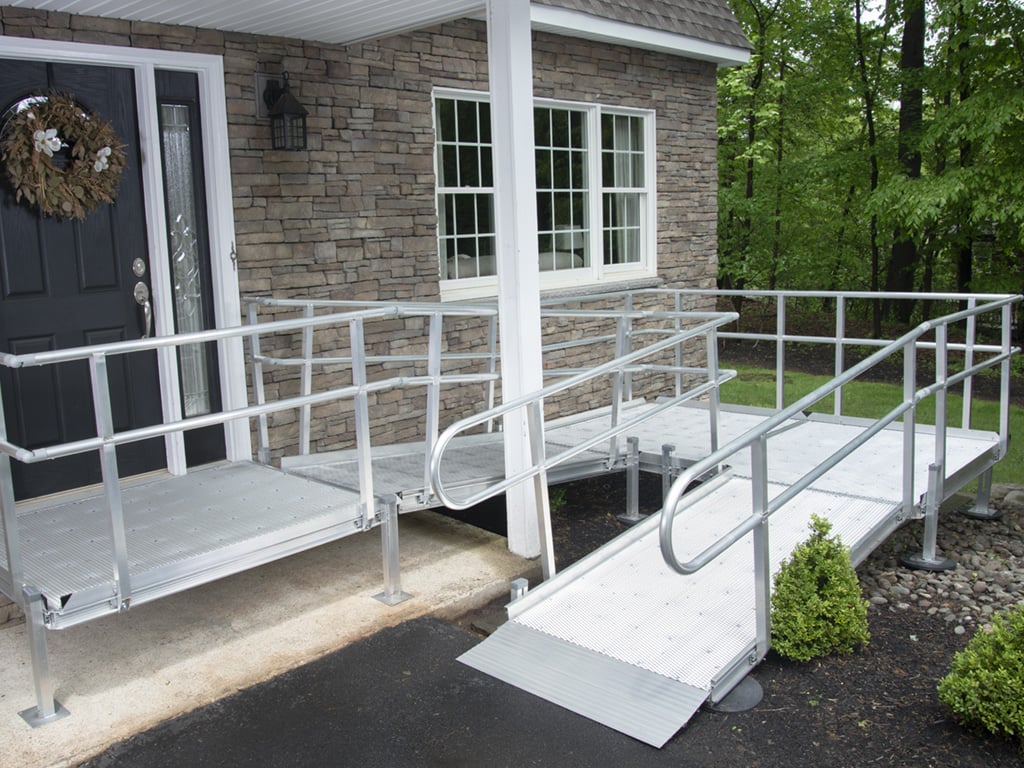 National Ramp Breeze Series open-mesh aluminum modular access ramp installed at a home entrance