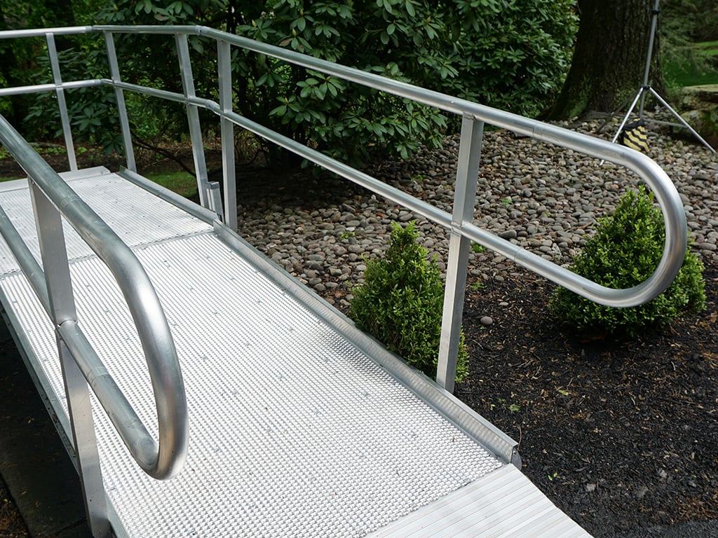 Breeze Series open-mesh aluminum ramp in a home garden