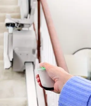 Wireless wall-mounted and handheld remote control for Elan stairlift