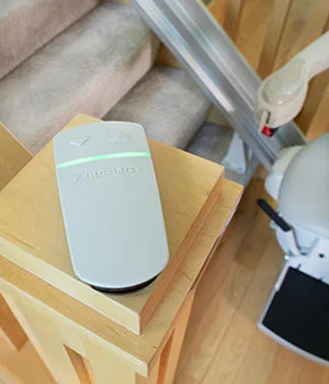 Wireless remote control for calling and sending the Elite straight indoor stairlift