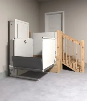 Compact footprint Bruno platform lift installed alongside residential exterior deck steps