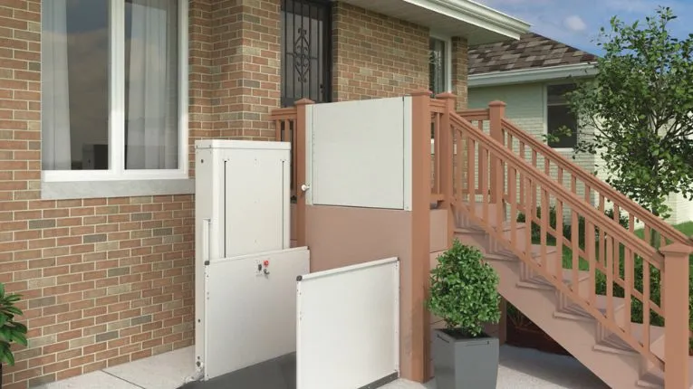 Bruno platform lift top landing gate installed on a porch deck
