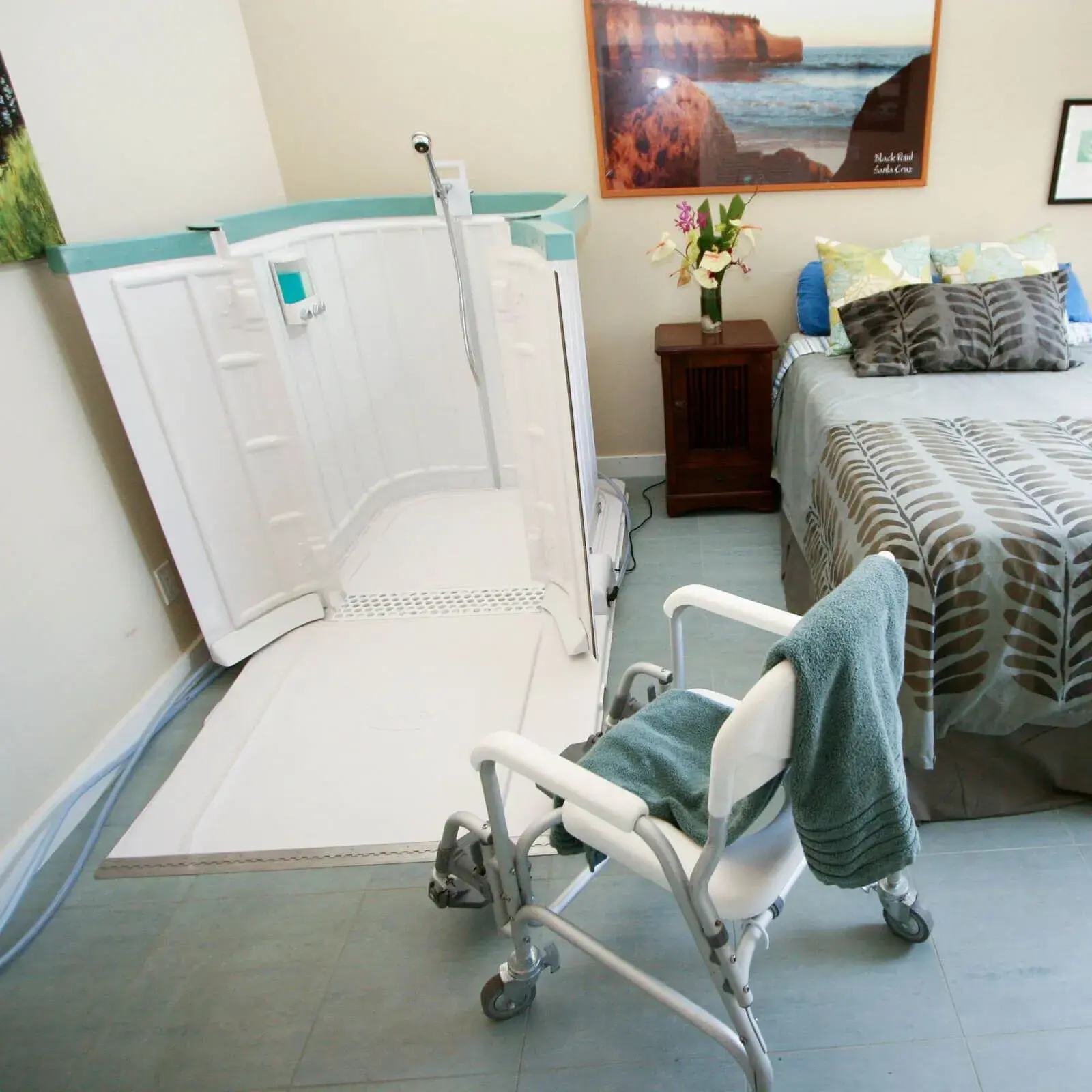 Shower Bay portable wheelchair accessible roll-in shower stall set up in a residential bedroom
