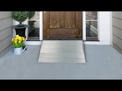 Aluminum threshold ramp fitted flush to an exterior residential entrance door sill